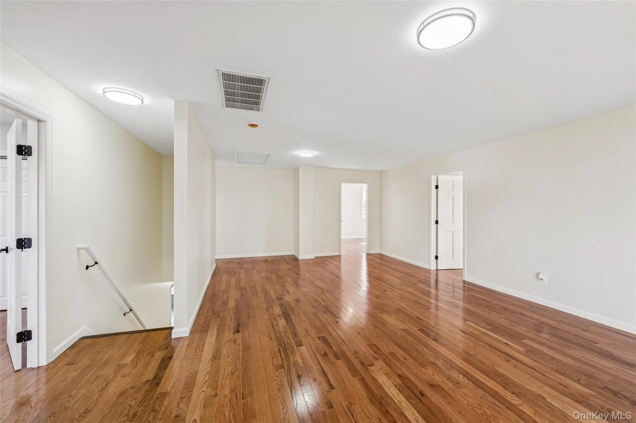 Second Floor Living Room with sliding doors to balcony deck with access to first floor patio Second Floor Living Room with sliding doors to balcony deck with access to first floor patio