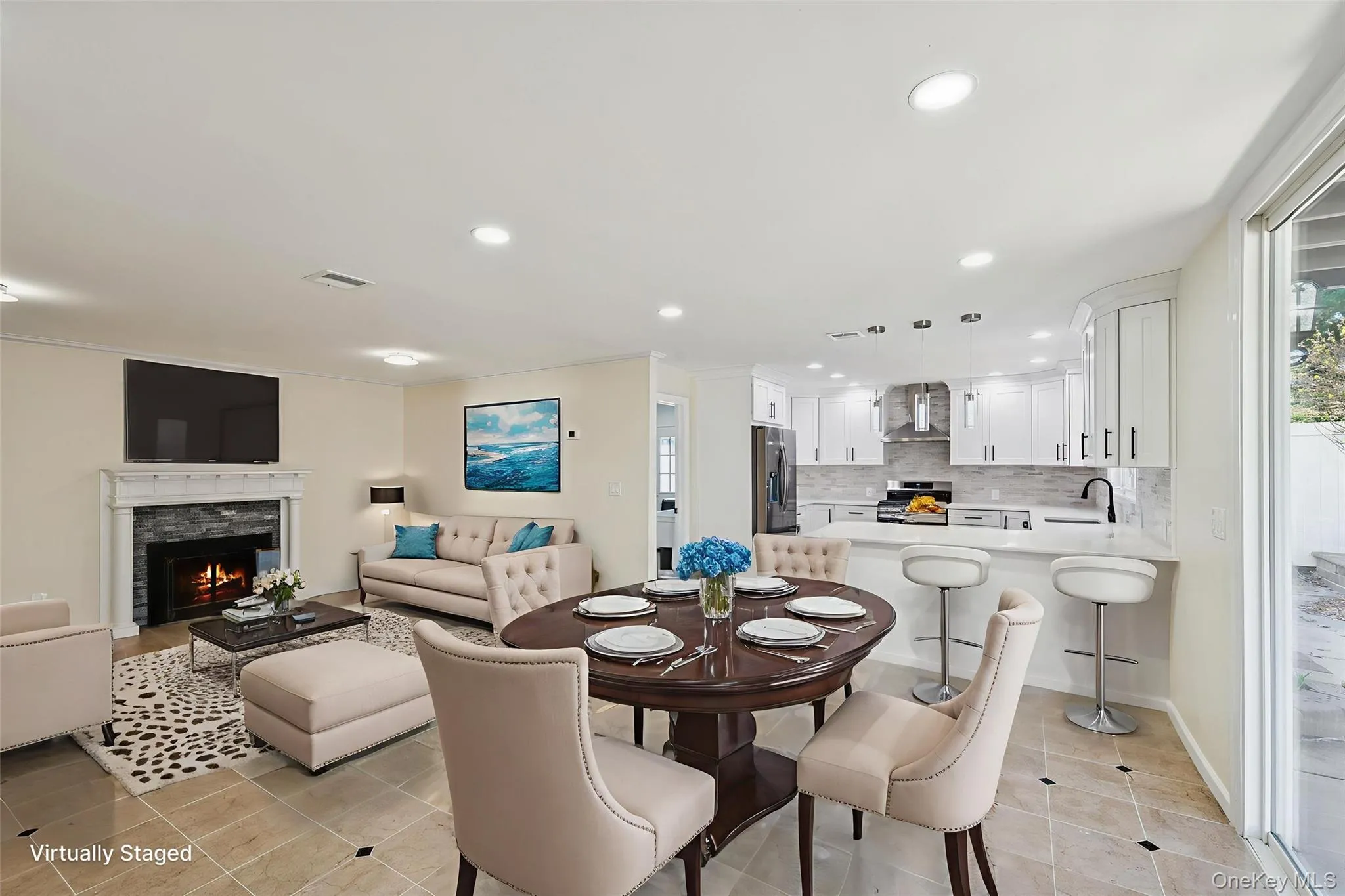 Open-concept living space featuring a dining area, kitchen, and living room Open-concept living space featuring a dining area, kitchen, and living room