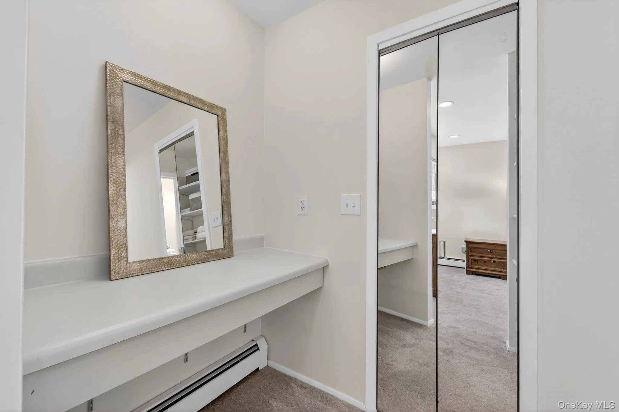 Vanity area outside of primary bedroom walk-in closet Vanity area outside of primary bedroom walk-in closet