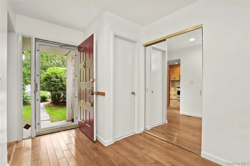 Entryway with light wood-type flooring, baseboards, and recessed lighting Entryway with light wood-type flooring, baseboards, and recessed lighting