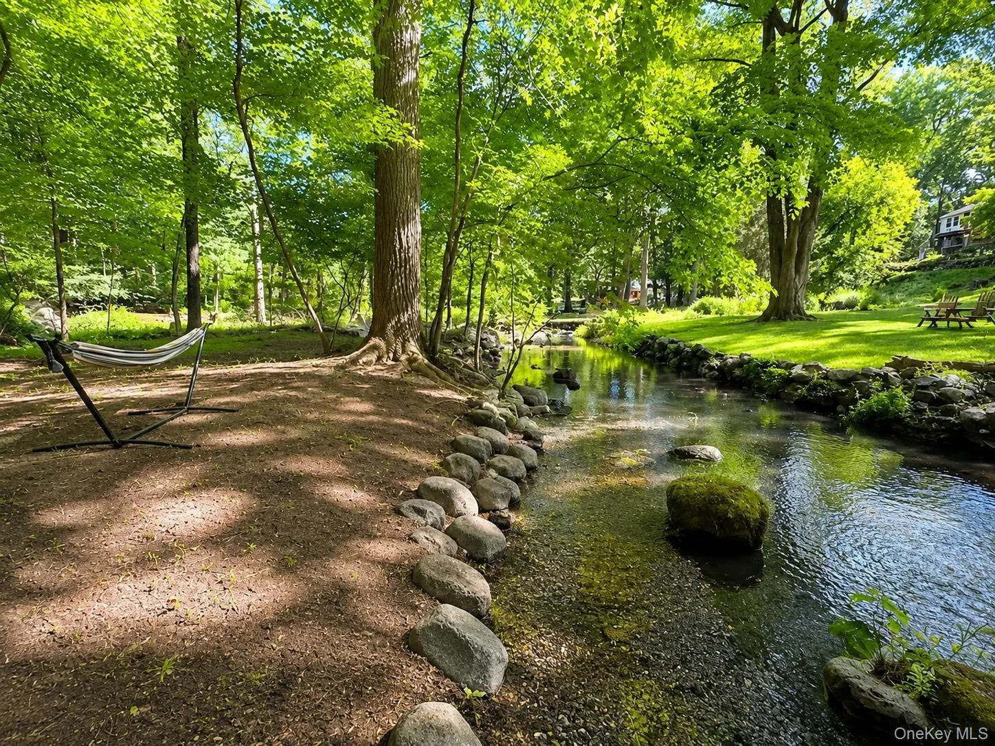 Enjoy a nap in your hammock by the stream. Enjoy a nap in your hammock by the stream.