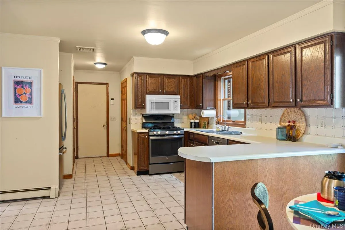There's an entrance directly from the two-car garage and separate pantry. There's an entrance directly from the two-car garage and separate pantry.