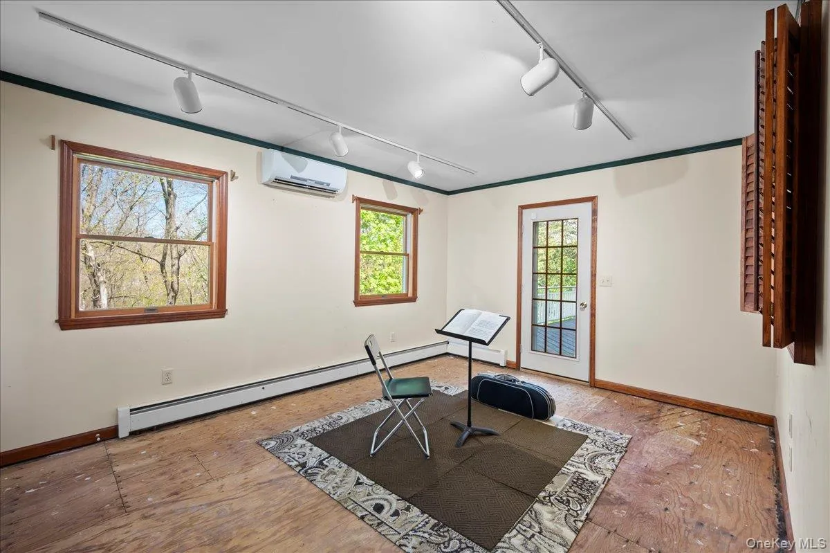 Add your choice of flooring to this room with dedicated HVAC, baseboard heat, and access to the home's deck. Add your choice of flooring to this room with dedicated HVAC, baseboard heat, and access to the home's deck.