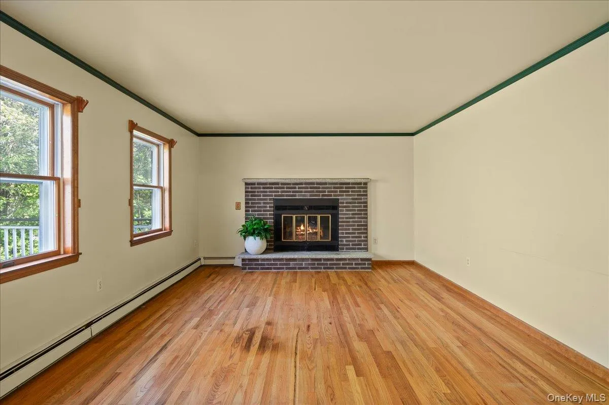 Build on the cozy vibe of hardwood floors and brick-surround fireplace. Build on the cozy vibe of hardwood floors and brick-surround fireplace.