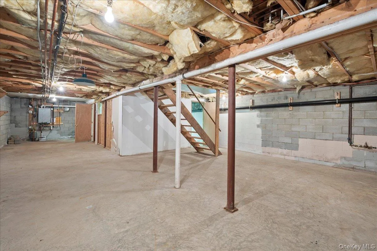 The full, unfinished basement is useful storage and work space that houses . . . The full, unfinished basement is useful storage and work space that houses . . .