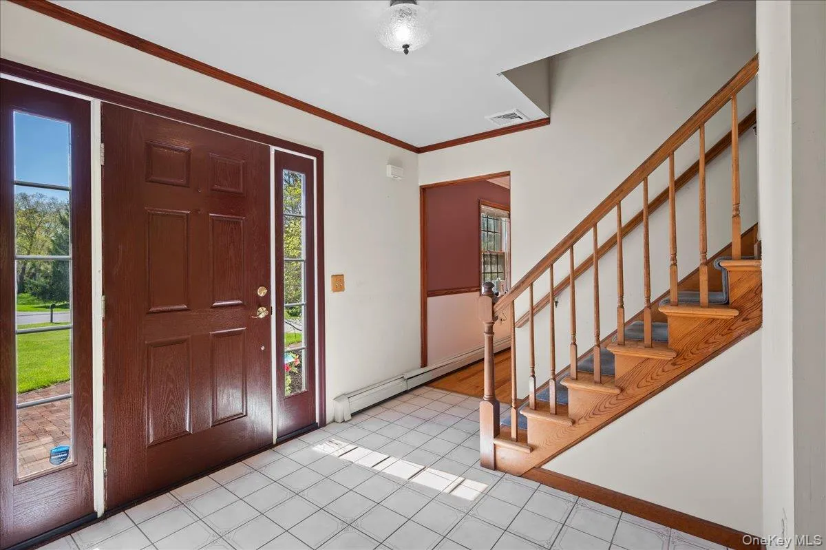 The tiled foyer is your entry point to a first floor layout with ... The tiled foyer is your entry point to a first floor layout with ...