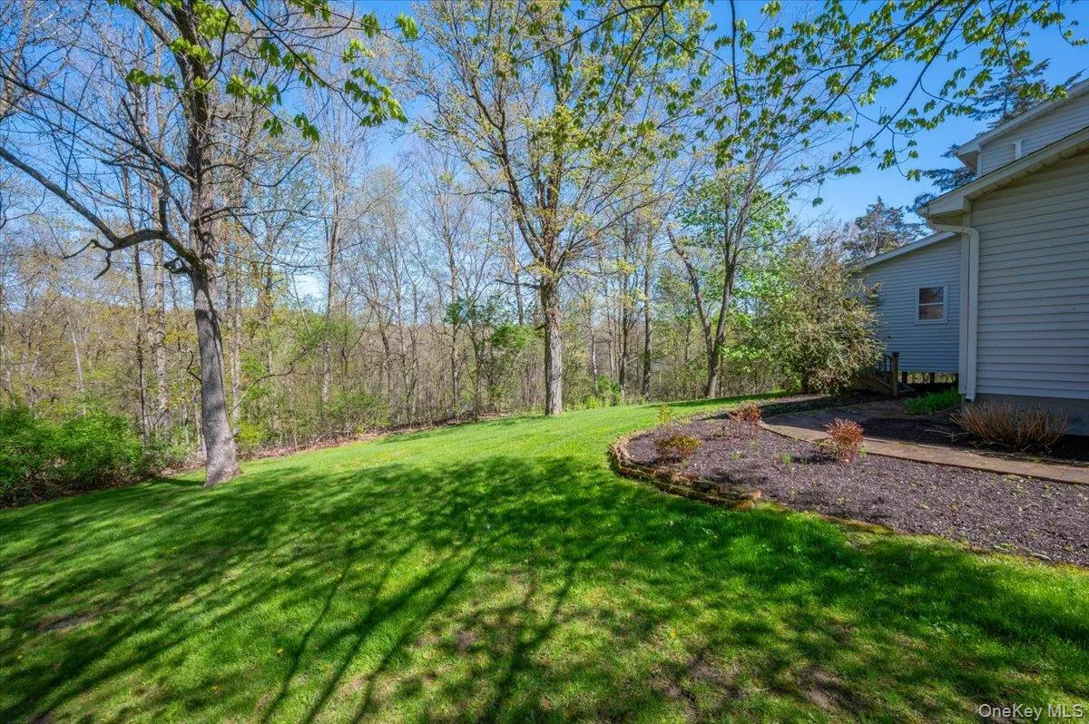 Follow the path around to the dedicated entrance of a single-room addition that's perfect for a home-based practice. Follow the path around to the dedicated entrance of a single-room addition that's perfect for a home-based practice.