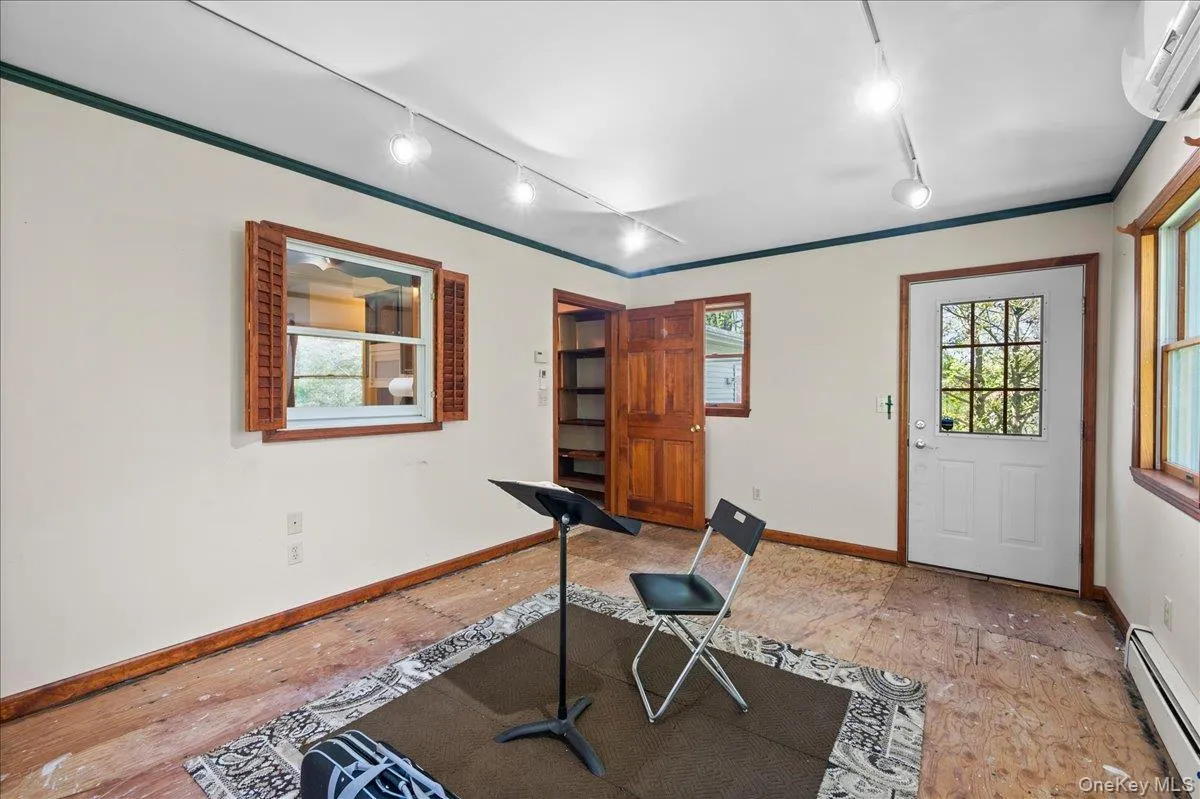 This single-room addition off the home's kitchen has its own exterior entrance -- perfect for a dedicated work space. This single-room addition off the home's kitchen has its own exterior entrance -- perfect for a dedicated work space.