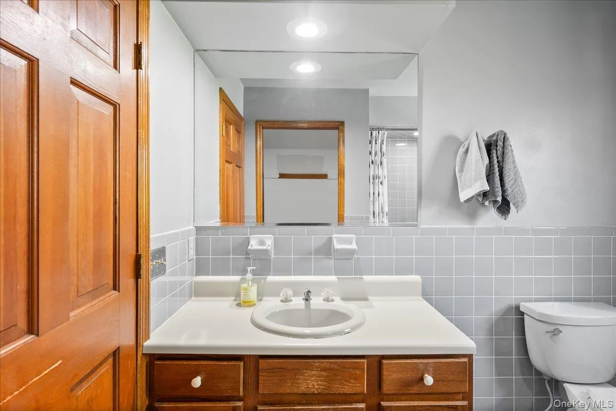 The roomy hall bath has a tub and hook-ups for a convenient stackable washer and dryer on the second floor. The roomy hall bath has a tub and hook-ups for a convenient stackable washer and dryer on the second floor.