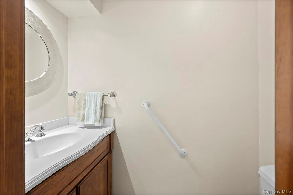 The first-floor half bath is across from the bonus room/home office. The first-floor half bath is across from the bonus room/home office.