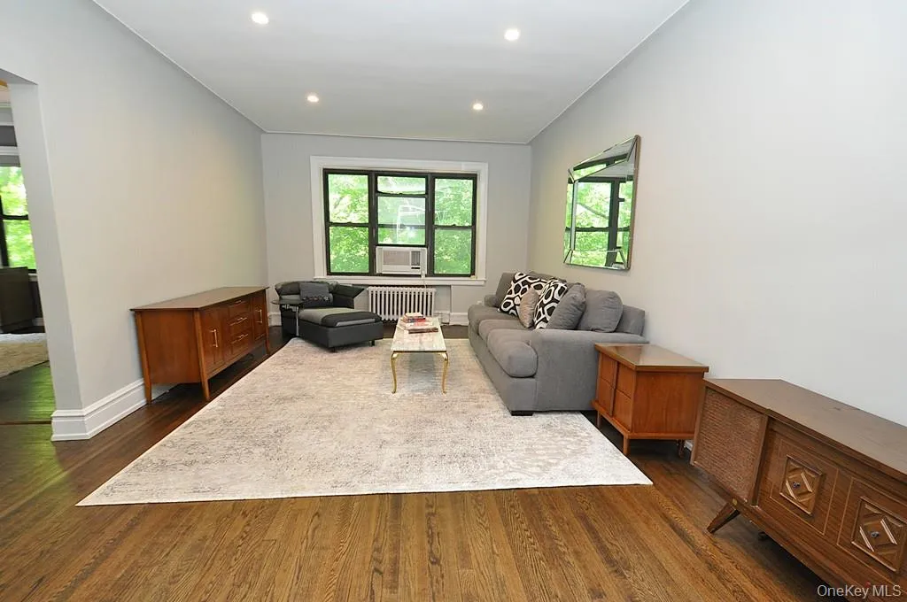Bright and Sunny living room overlooks Garth Woods and has recessed lighting and hardwood floors. Bright and Sunny living room overlooks Garth Woods and has recessed lighting and hardwood floors.