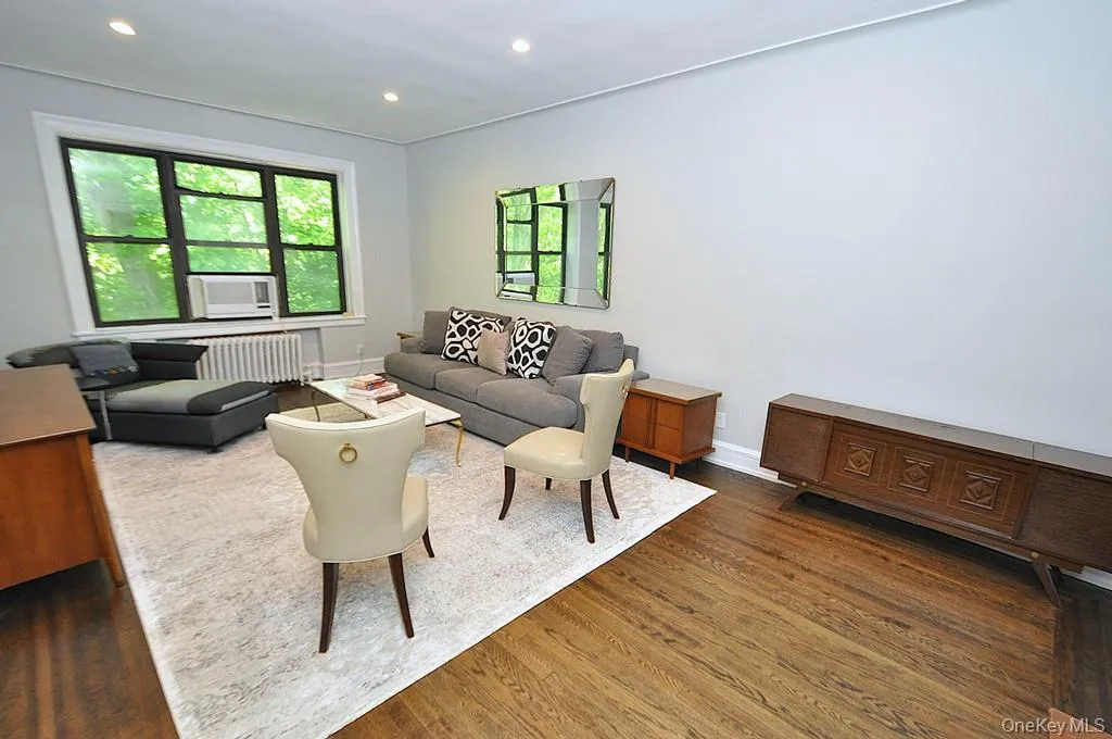 Bright and Sunny living room overlooks Garth Woods and has recessed lighting and hardwood floors. Bright and Sunny living room overlooks Garth Woods and has recessed lighting and hardwood floors.