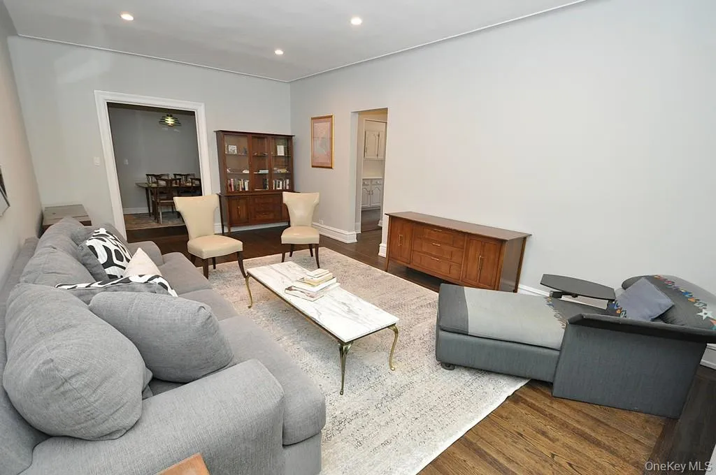 Bright and Sunny living room overlooks Garth Woods and has recessed lighting and hardwood floors. Bright and Sunny living room overlooks Garth Woods and has recessed lighting and hardwood floors.