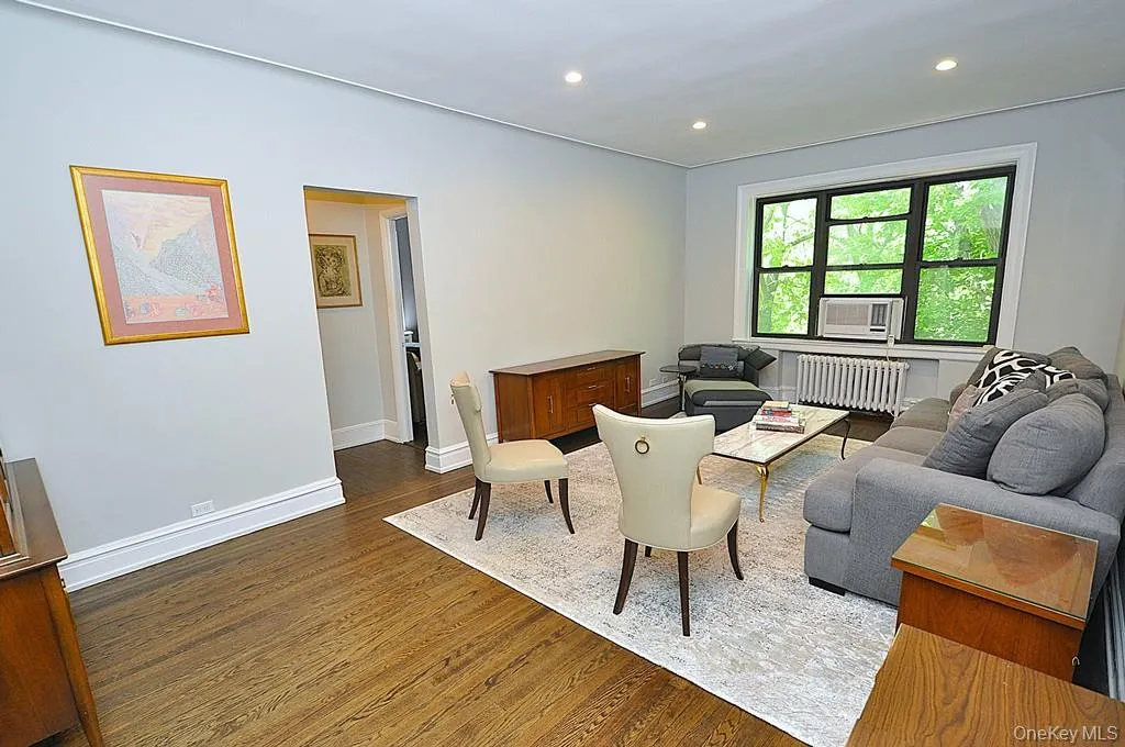 Bright and Sunny living room overlooks Garth Woods and has recessed lighting and hardwood floors. Bright and Sunny living room overlooks Garth Woods and has recessed lighting and hardwood floors.