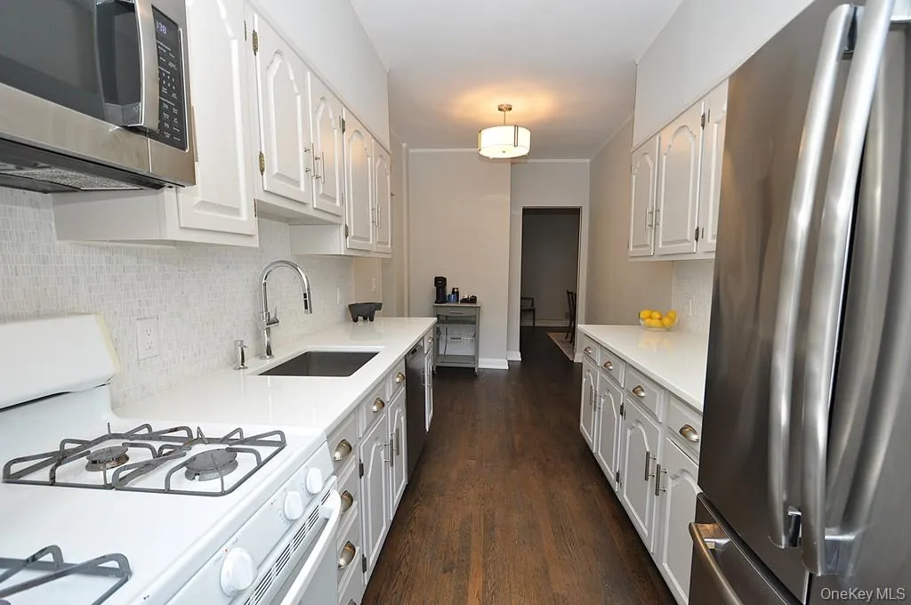 Updated Eat-In-Kitchen has Quartz counters and stainless steel appliances. Updated Eat-In-Kitchen has Quartz counters and stainless steel appliances.