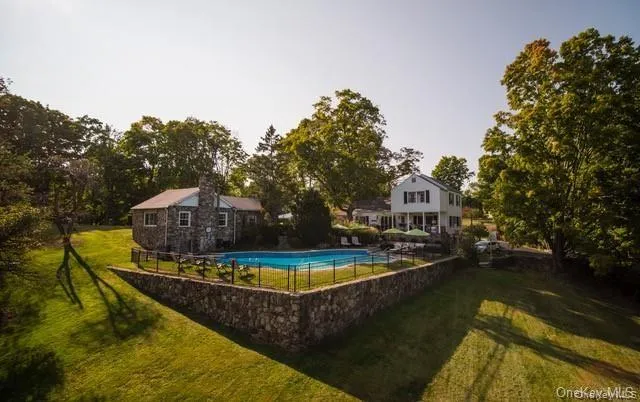View of swimming pool featuring a yard View of swimming pool featuring a yard