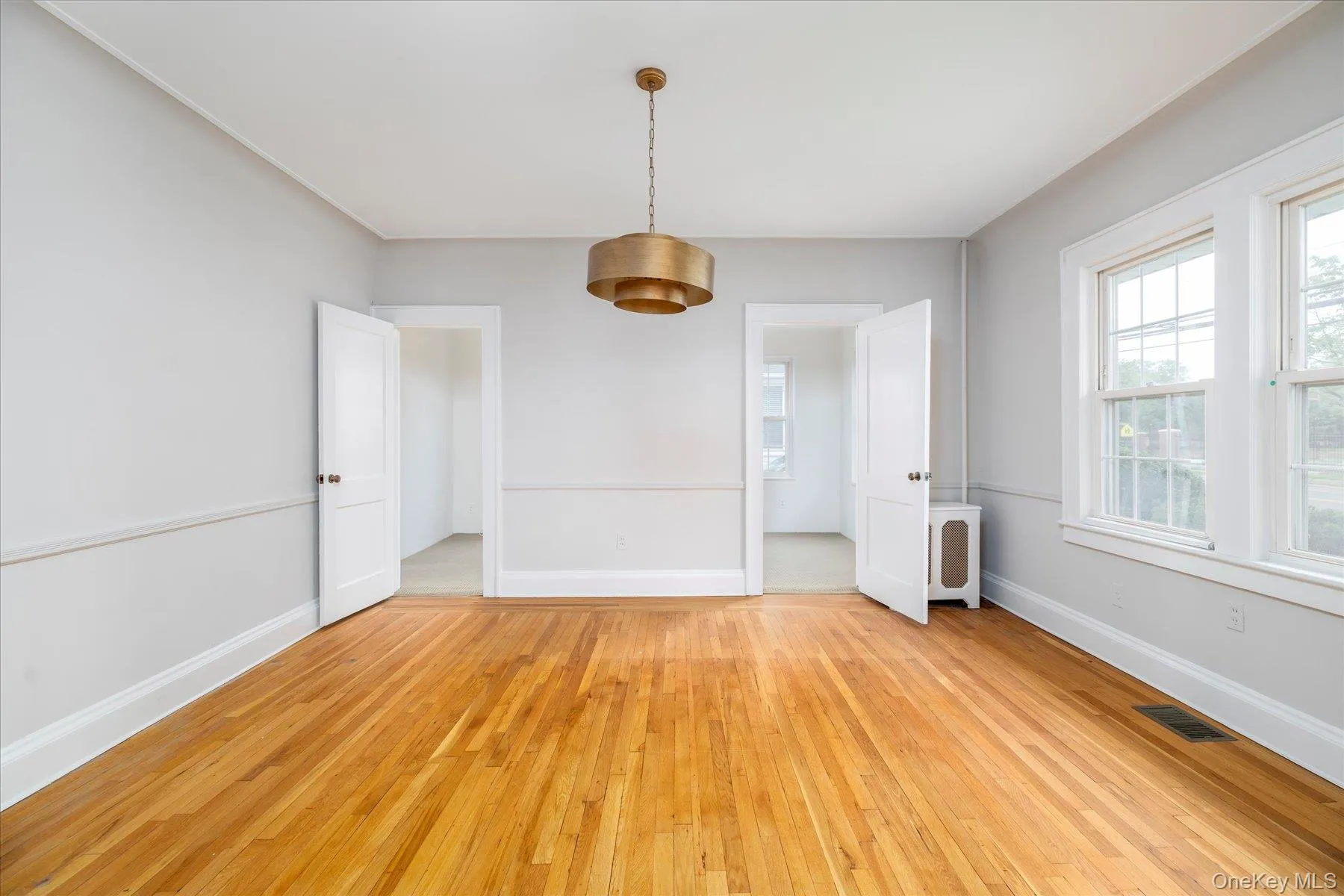 Formal Dinning room with doors to the Den Formal Dinning room with doors to the Den