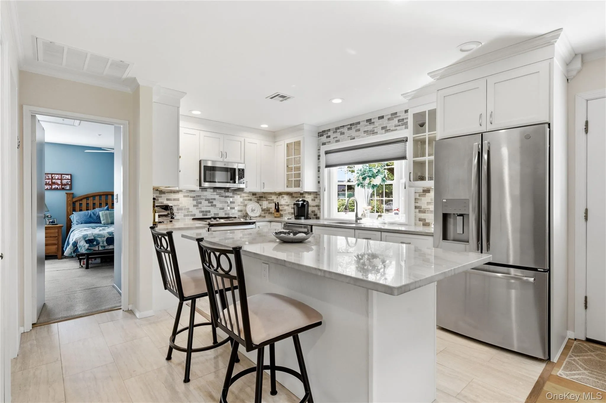 Large island and bay window in the kitchen. Large island and bay window in the kitchen.