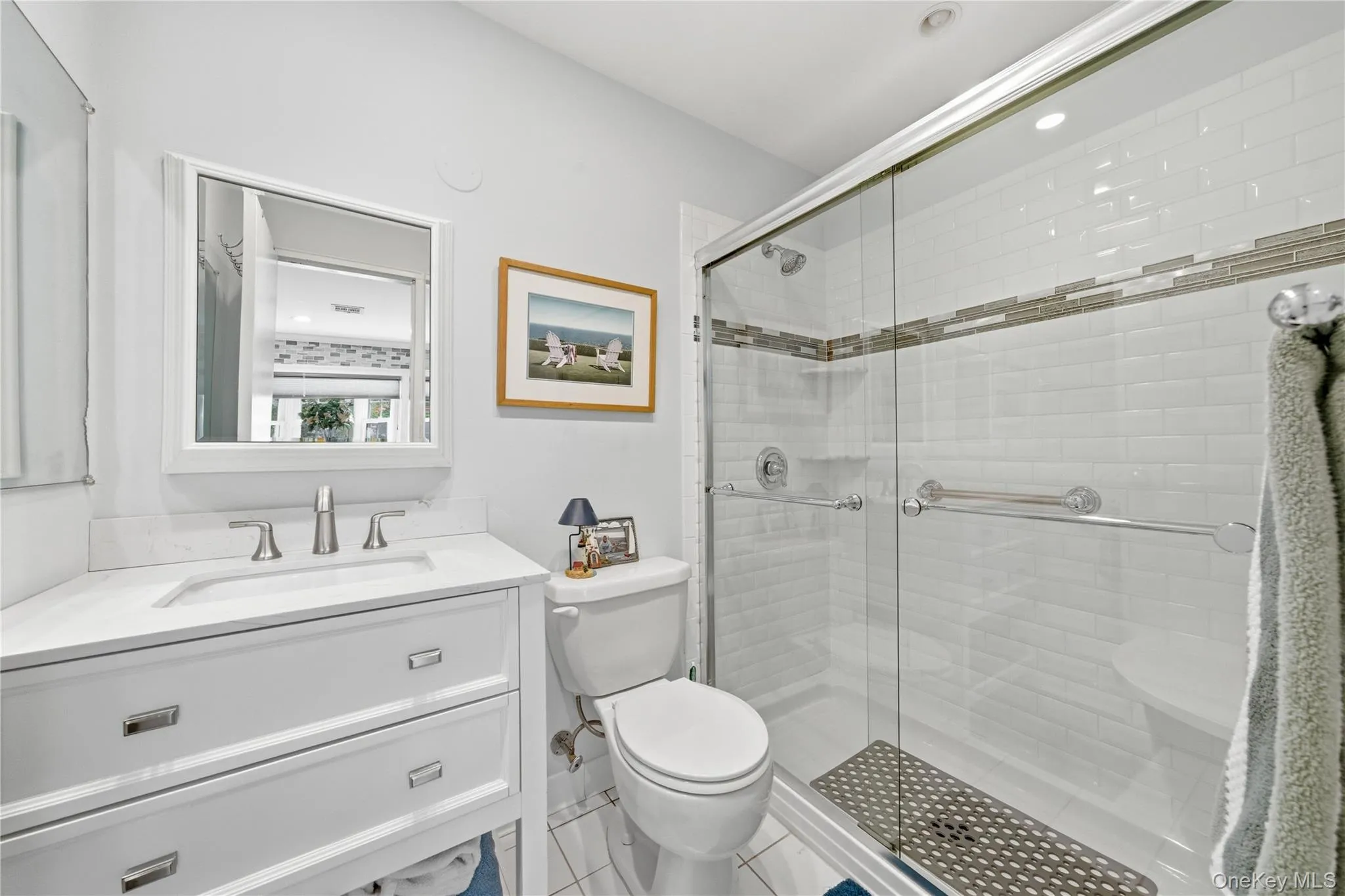 Renovated bathroom with step in shower. Renovated bathroom with step in shower.