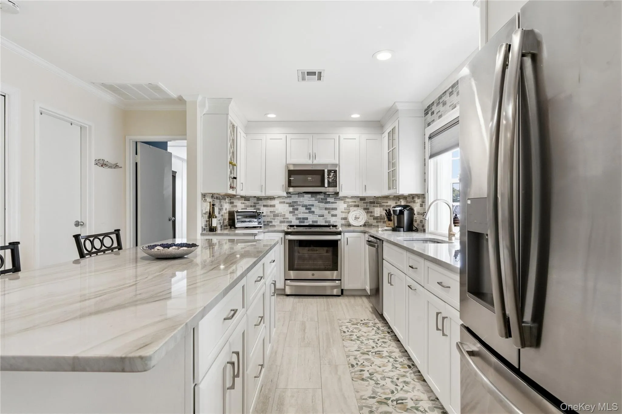 Renovated open kitchen with large island. Renovated open kitchen with large island.