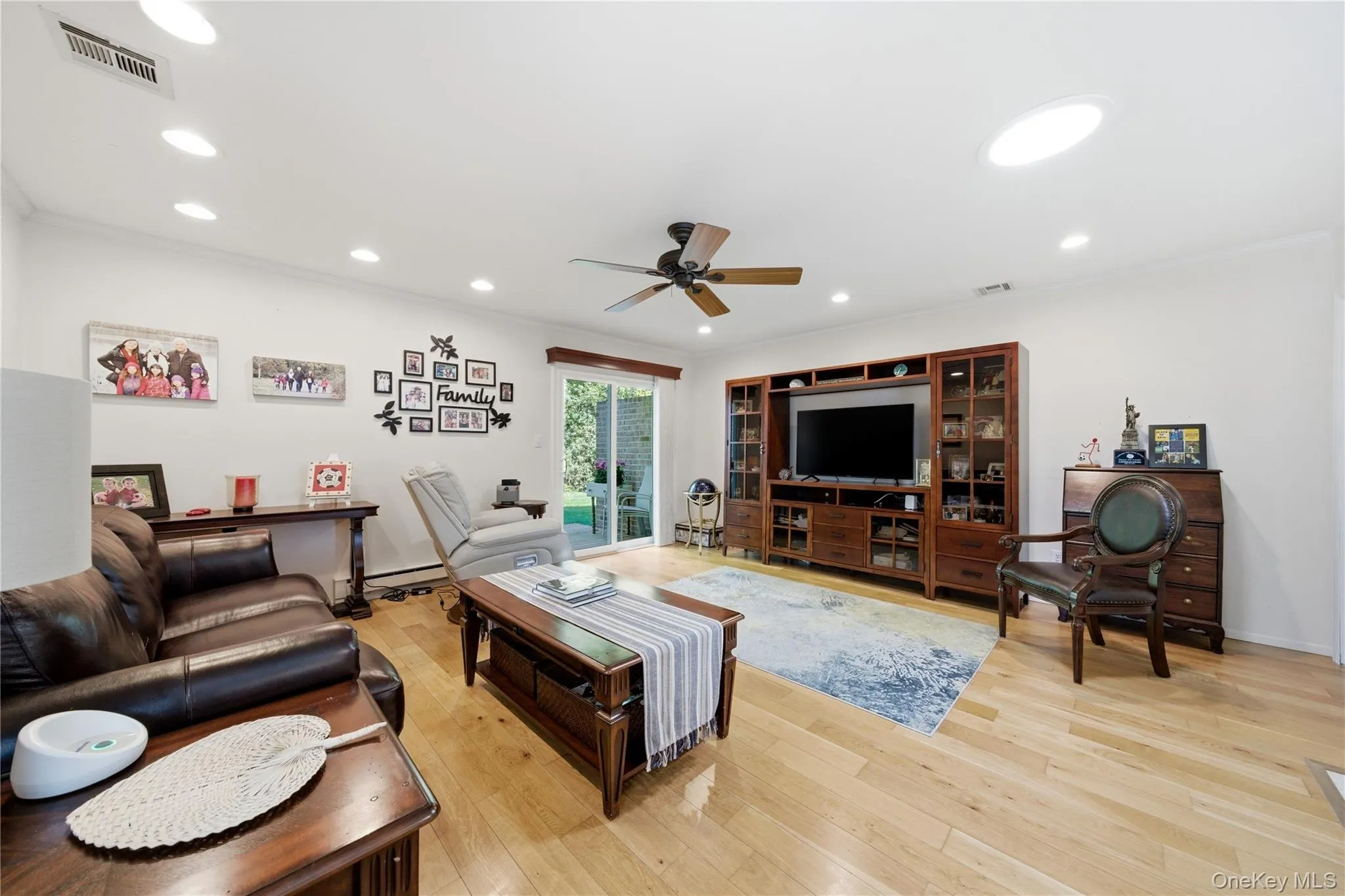 Spacious living room with sliding doors to patio. Spacious living room with sliding doors to patio.