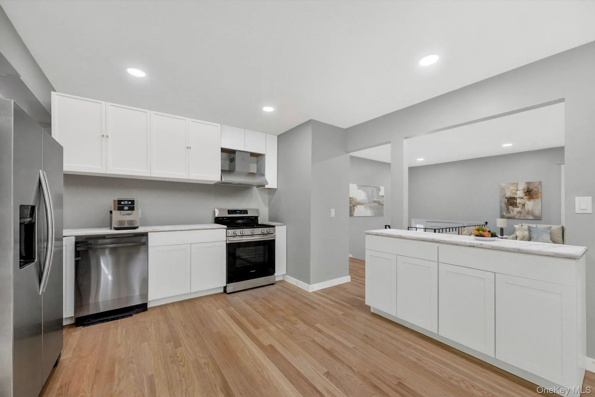Virtually Staged. The renovated kitchen features a fresh, updated look with new appliances, making meal prep and everyday cooking both stylish and functional. Virtually Staged. The renovated kitchen features a fresh, updated look with new appliances, making meal prep and everyday cooking both stylish and functional.