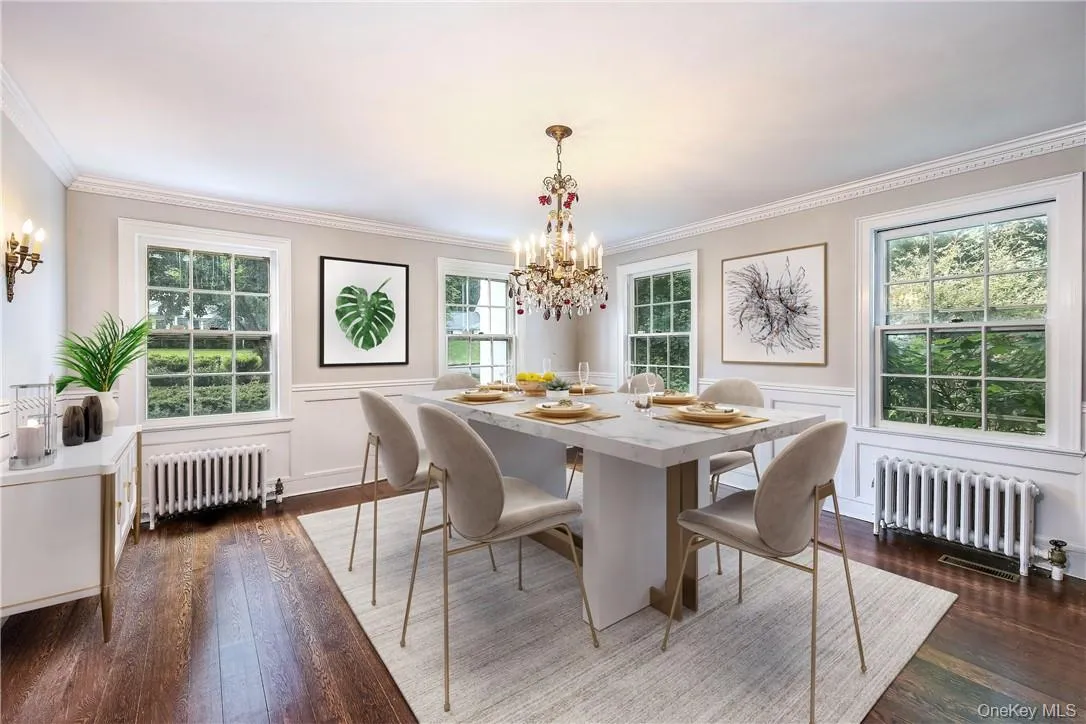 Digitally staged, this is a gracious formal dining room, perfect for family gatherings. Digitally staged, this is a gracious formal dining room, perfect for family gatherings.