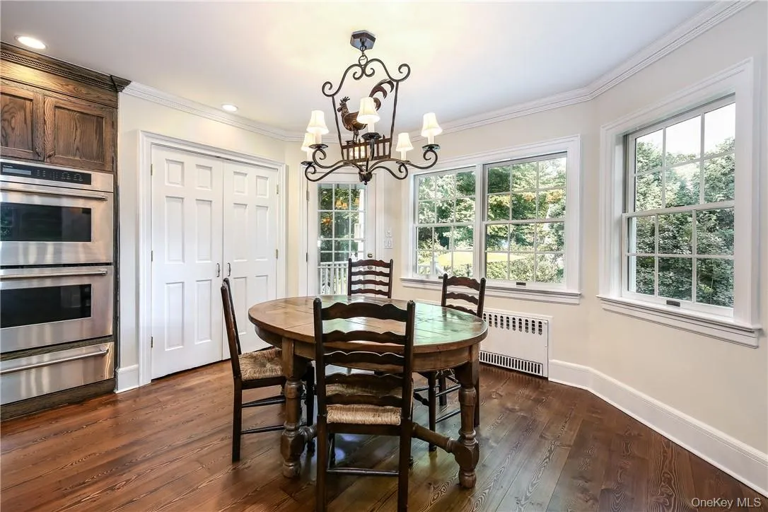 Enjoy peaceful yard views from this bright dining area. Enjoy peaceful yard views from this bright dining area.