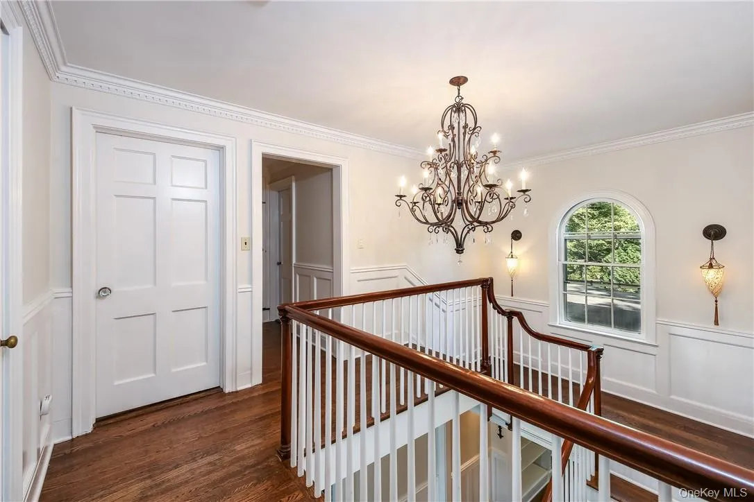 Generously proportioned upstairs landing with gorgeous hardwood floors, gracious railing and lovely window. Generously proportioned upstairs landing with gorgeous hardwood floors, gracious railing and lovely window.