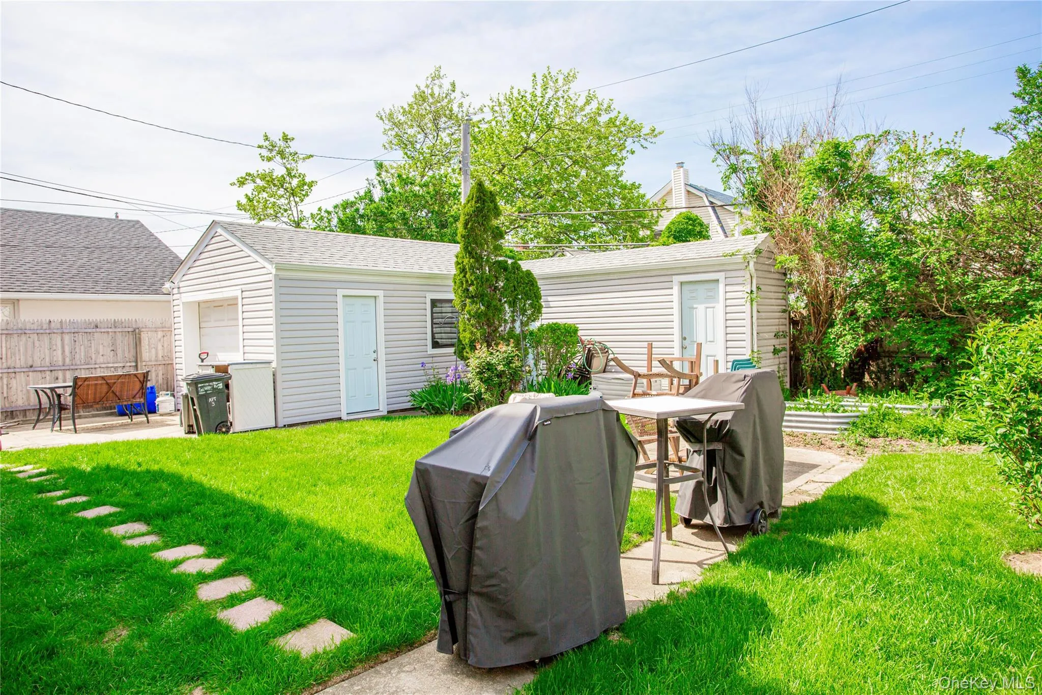 View of yard featuring a patio and an outdoor structure View of yard featuring a patio and an outdoor structure