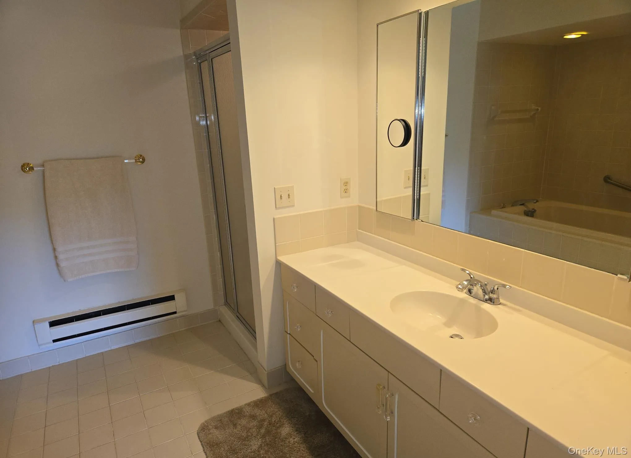 There is an oversized vanity in the primary bathroom. There is an oversized vanity in the primary bathroom.