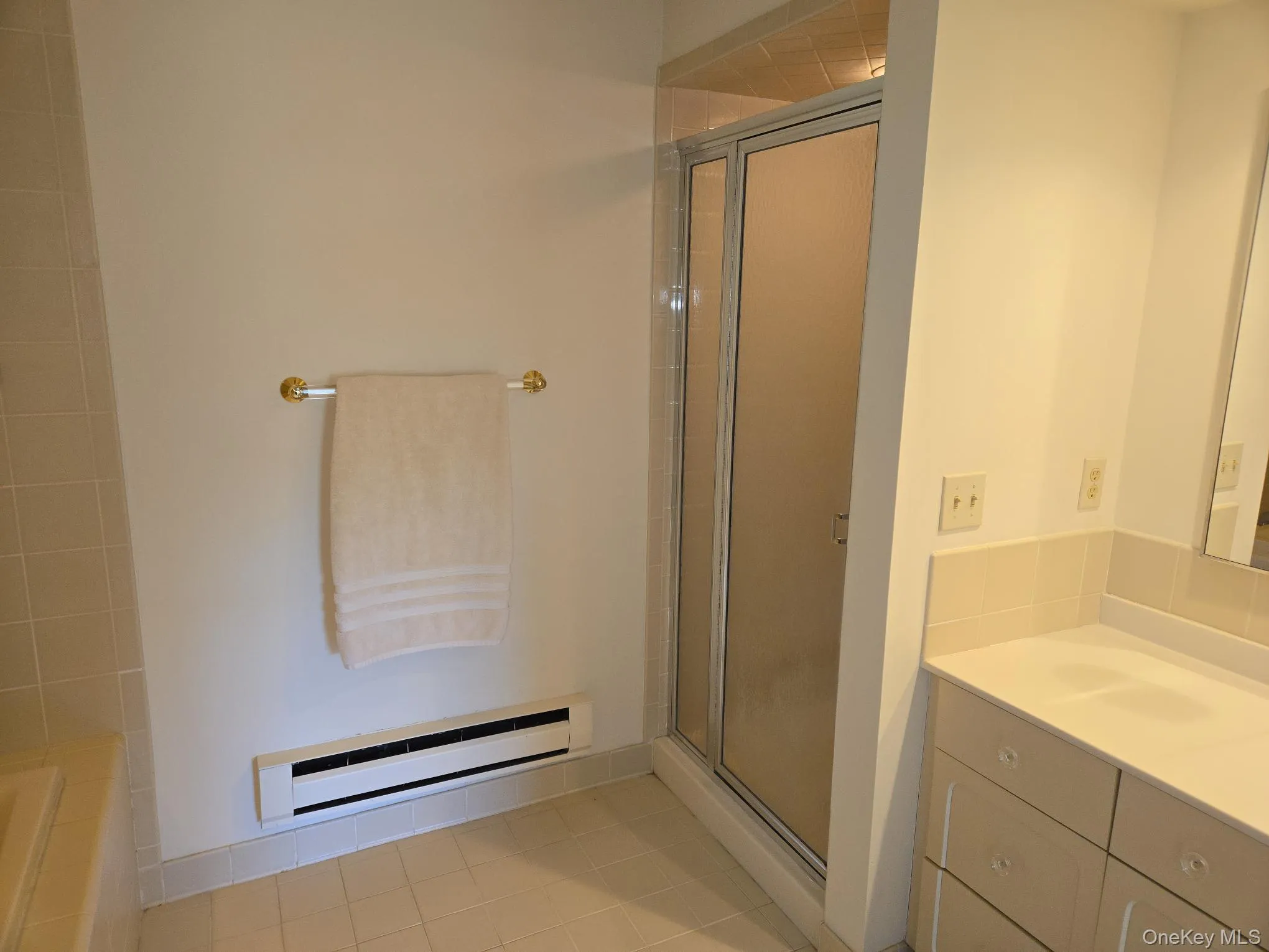 The primary bathroom also offers a stall shower. The primary bathroom also offers a stall shower.