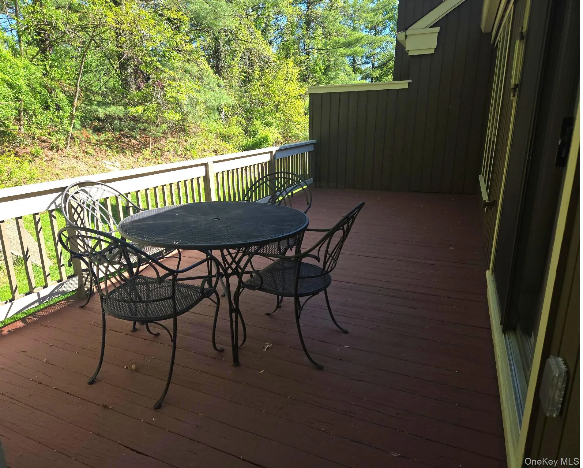 There is a large rear deck overlooking a private yard area. There is a large rear deck overlooking a private yard area.