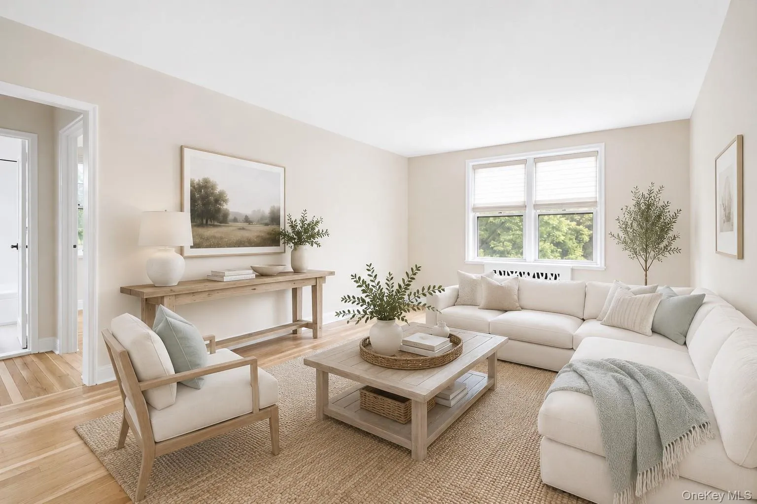 Virtually Staged - Living area featuring light-toned walls and wood-finish flooring Virtually Staged - Living area featuring light-toned walls and wood-finish flooring