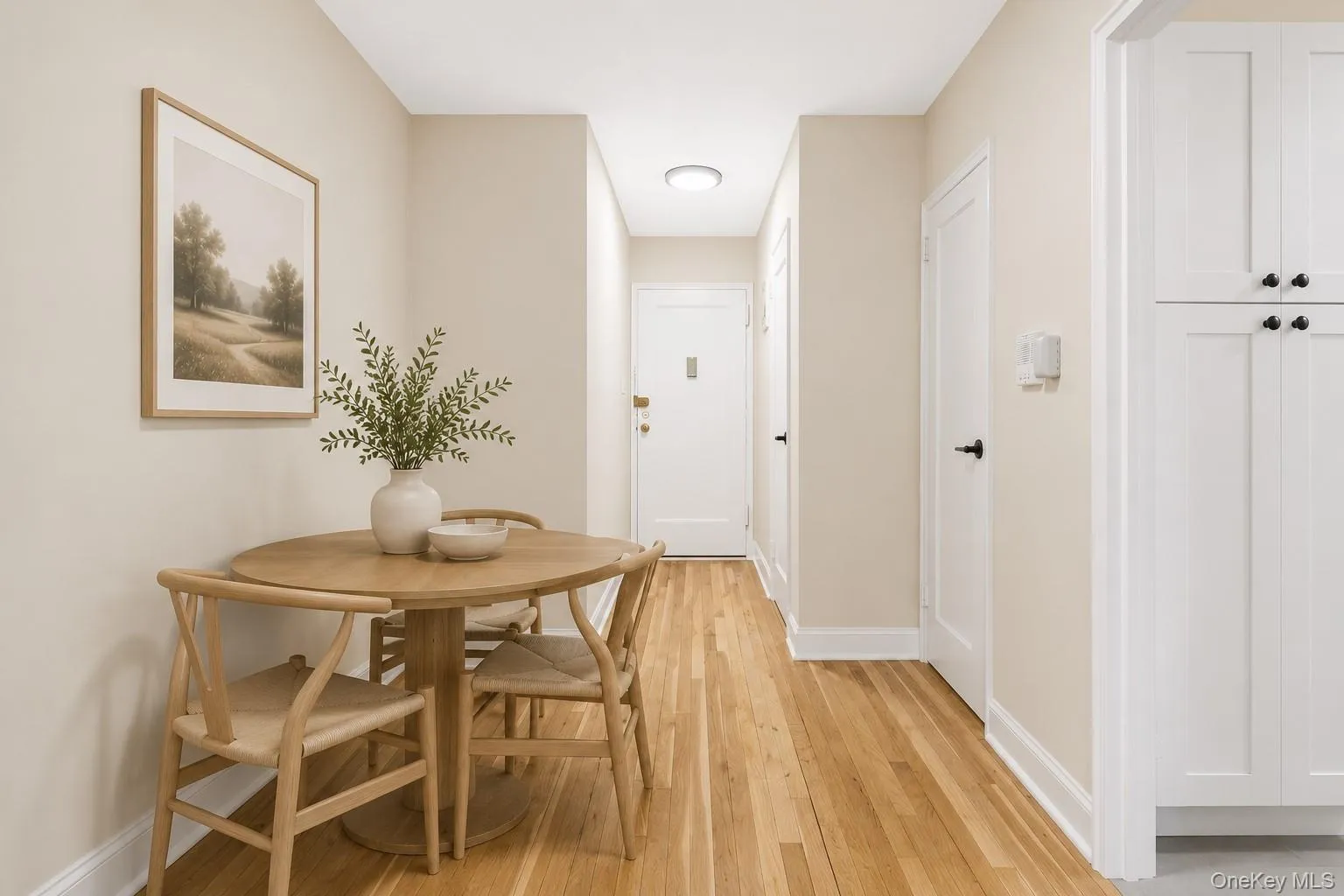 Virtually Staged - Open concept dining space featuring wood-finish flooring, light neutral wall tones, and white trim Virtually Staged - Open concept dining space featuring wood-finish flooring, light neutral wall tones, and white trim
