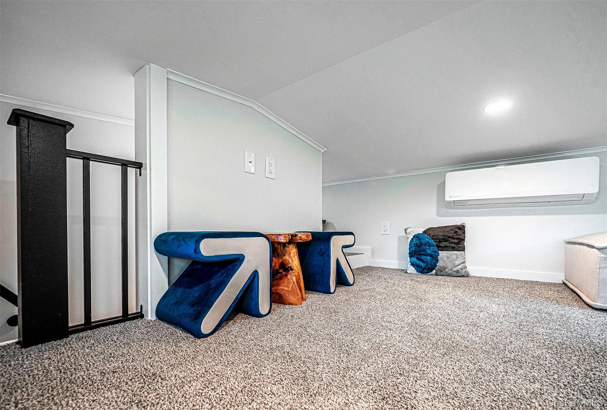 Loft area featuring carpet flooring, a wall unit AC, and recessed lighting Loft area featuring carpet flooring, a wall unit AC, and recessed lighting