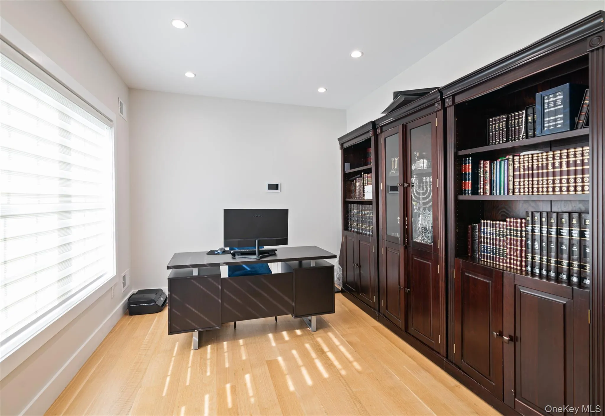 Office space featuring light wood-type flooring and recessed lighting Office space featuring light wood-type flooring and recessed lighting
