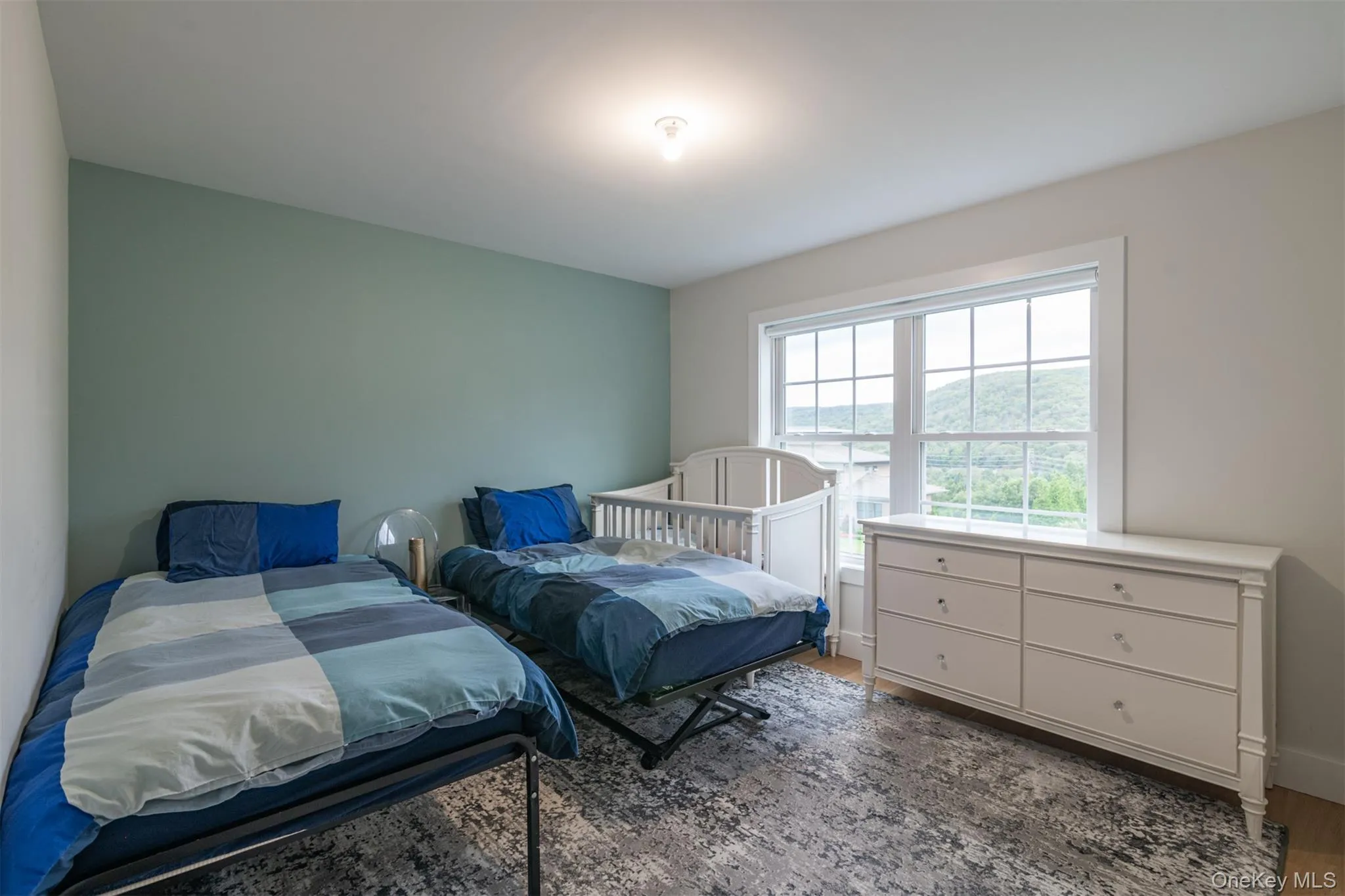 Bedroom featuring dark wood-style flooring Bedroom featuring dark wood-style flooring