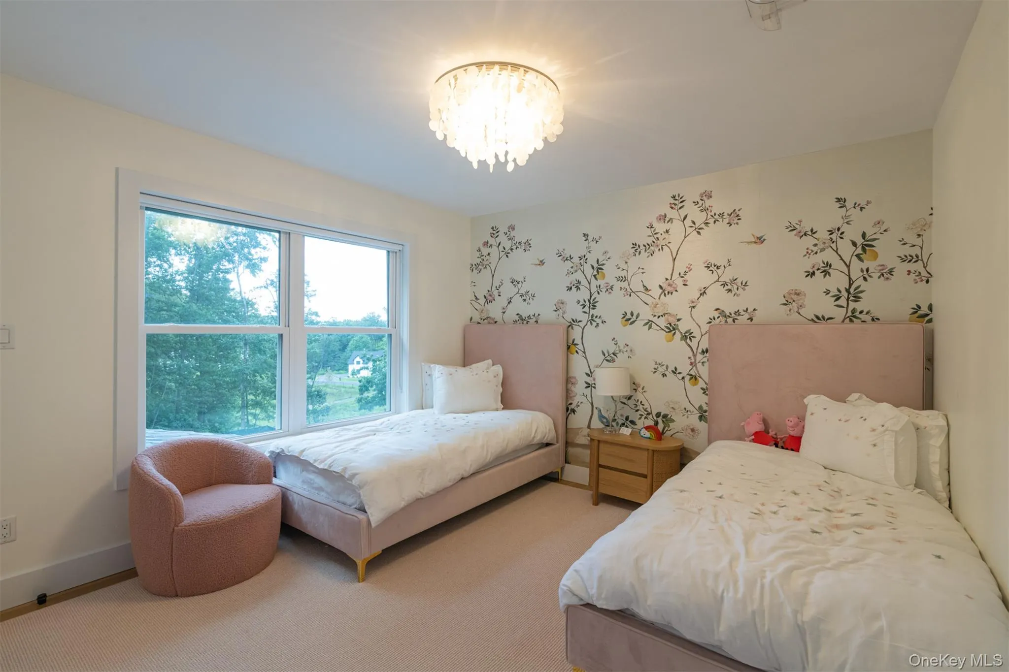 Bedroom featuring carpet flooring and a chandelier Bedroom featuring carpet flooring and a chandelier