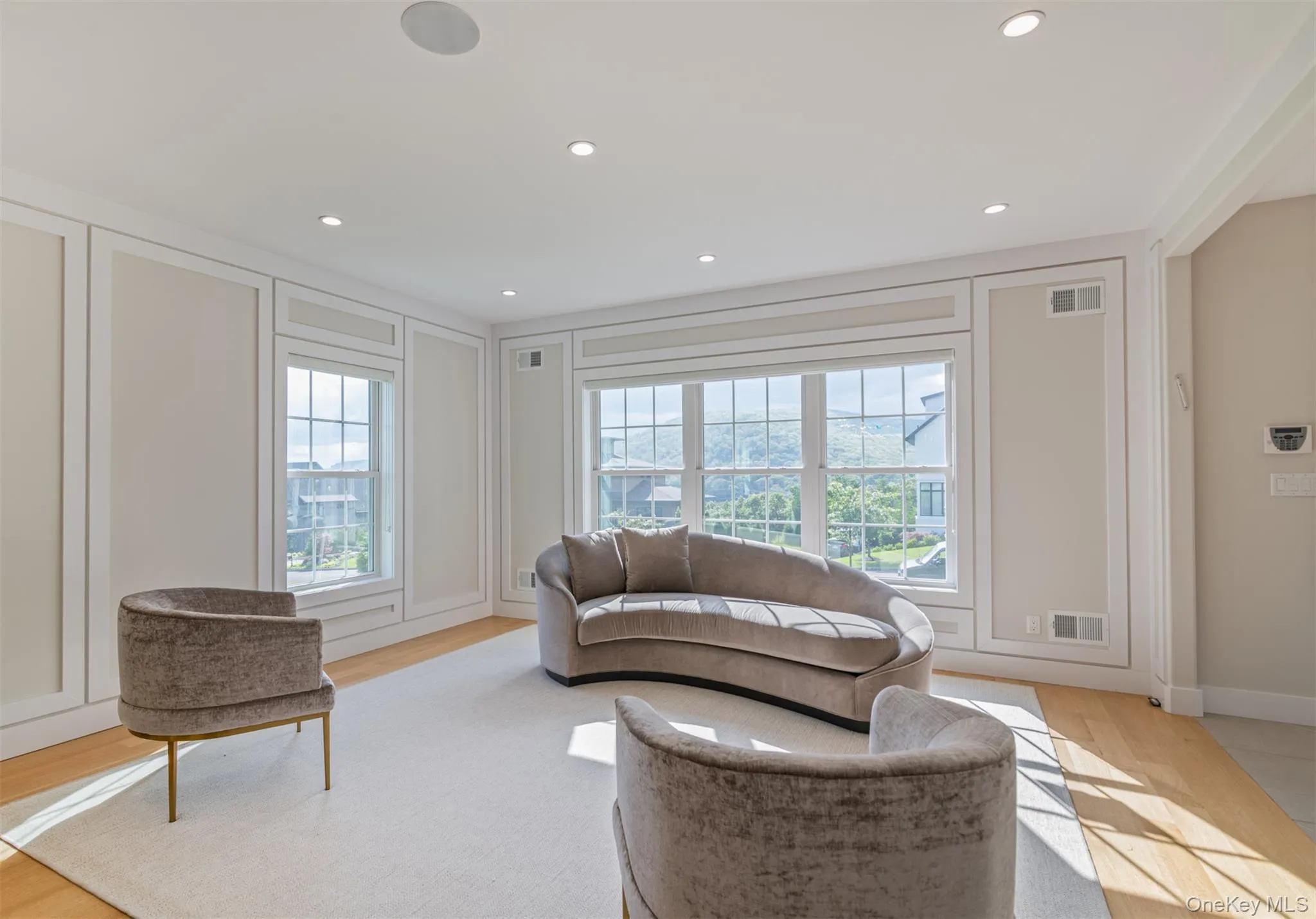 Living room featuring recessed lighting and light wood-style floors Living room featuring recessed lighting and light wood-style floors