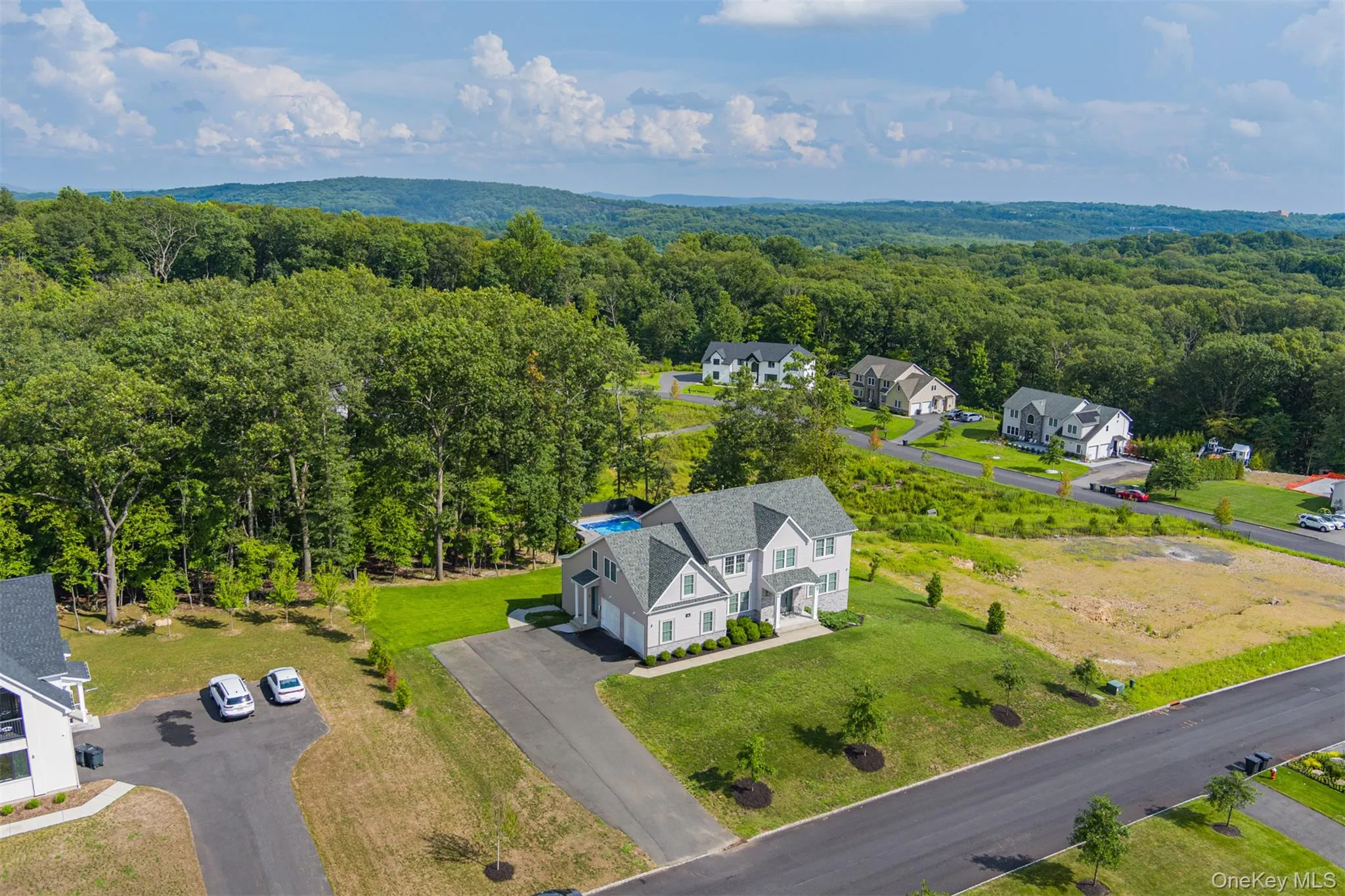 Aerial perspective of suburban area featuring a heavily wooded area Aerial perspective of suburban area featuring a heavily wooded area