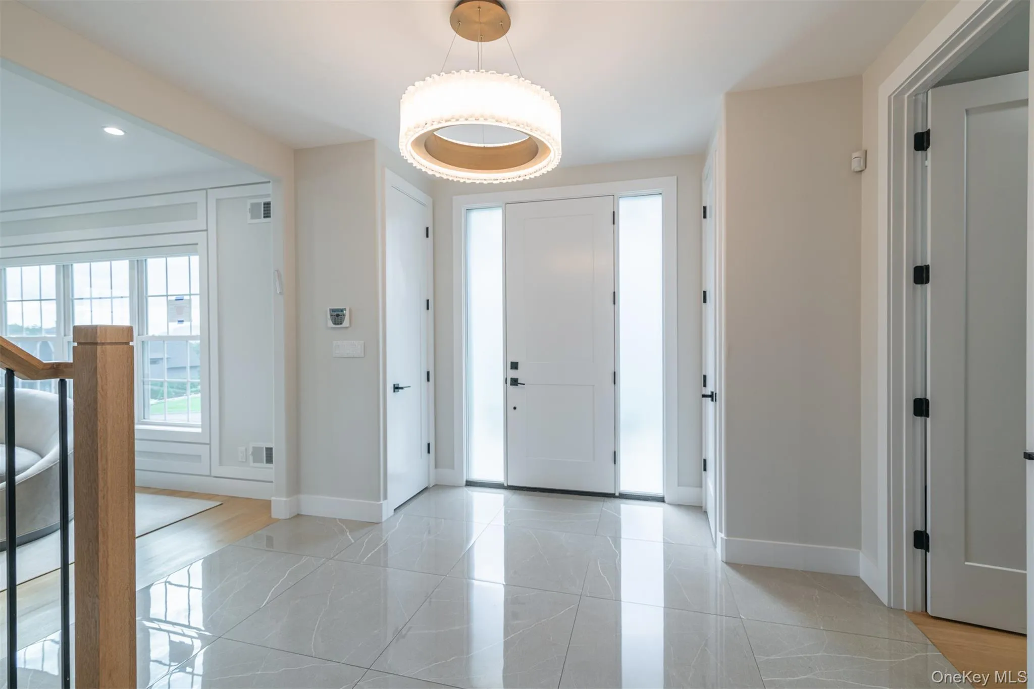 Entrance foyer featuring baseboards and recessed lighting Entrance foyer featuring baseboards and recessed lighting