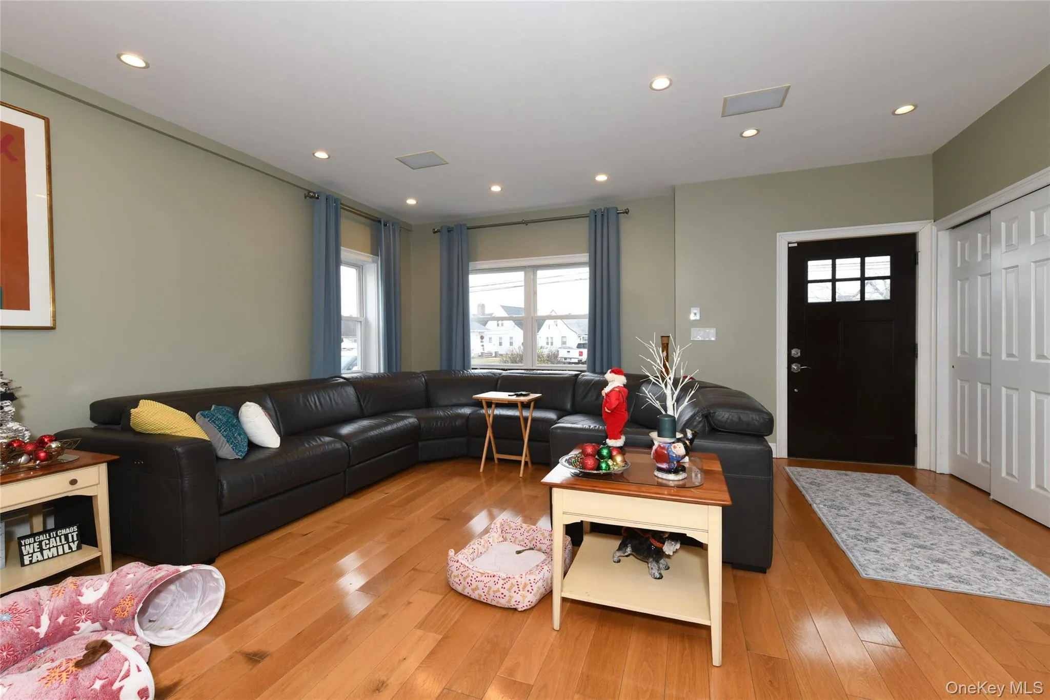 Living area featuring recessed lighting and light wood-style floors Living area featuring recessed lighting and light wood-style floors