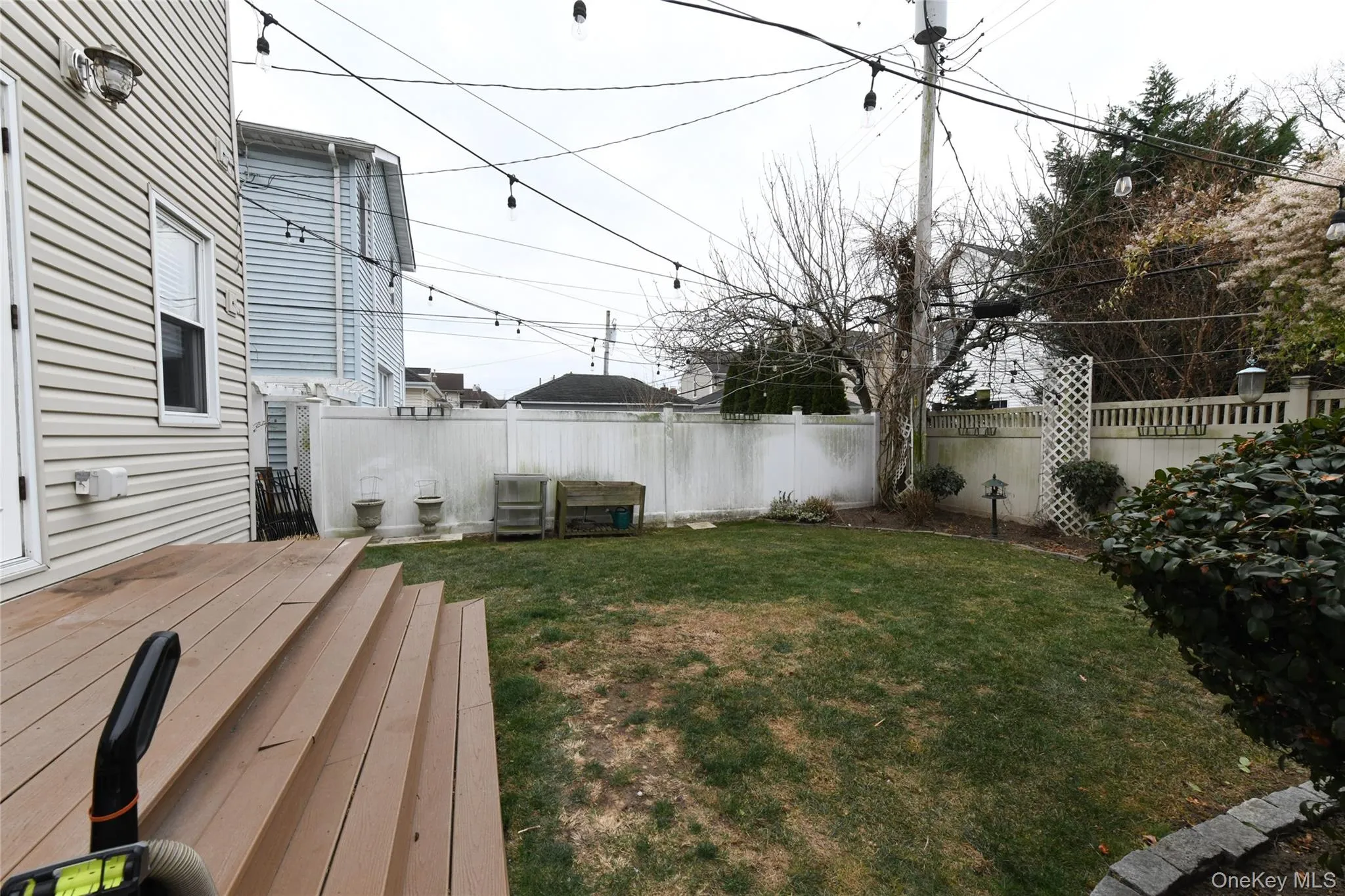 Fenced backyard featuring a deck Fenced backyard featuring a deck