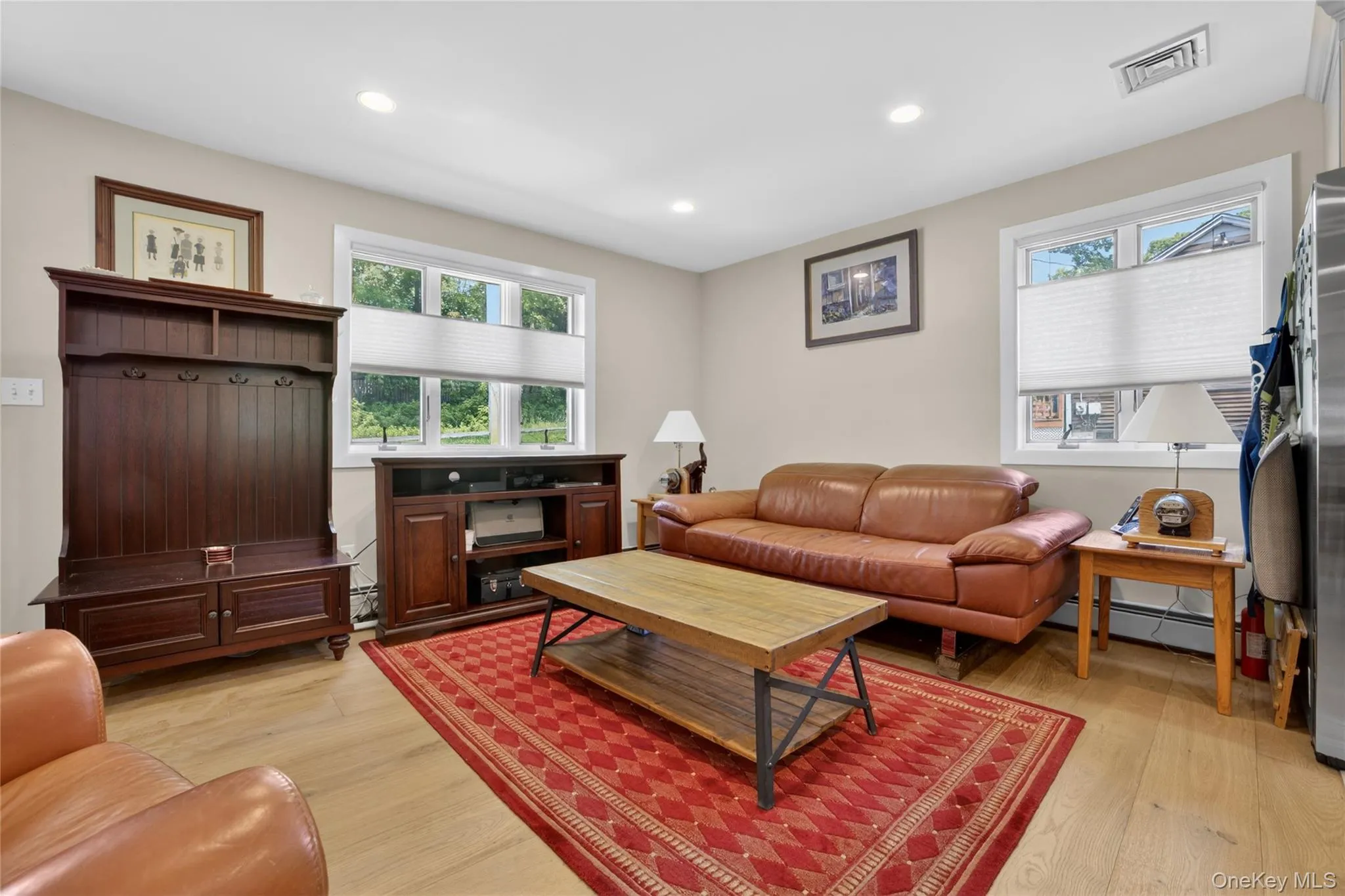 Living room with so much natural light from the numerous windows. Living room with so much natural light from the numerous windows.
