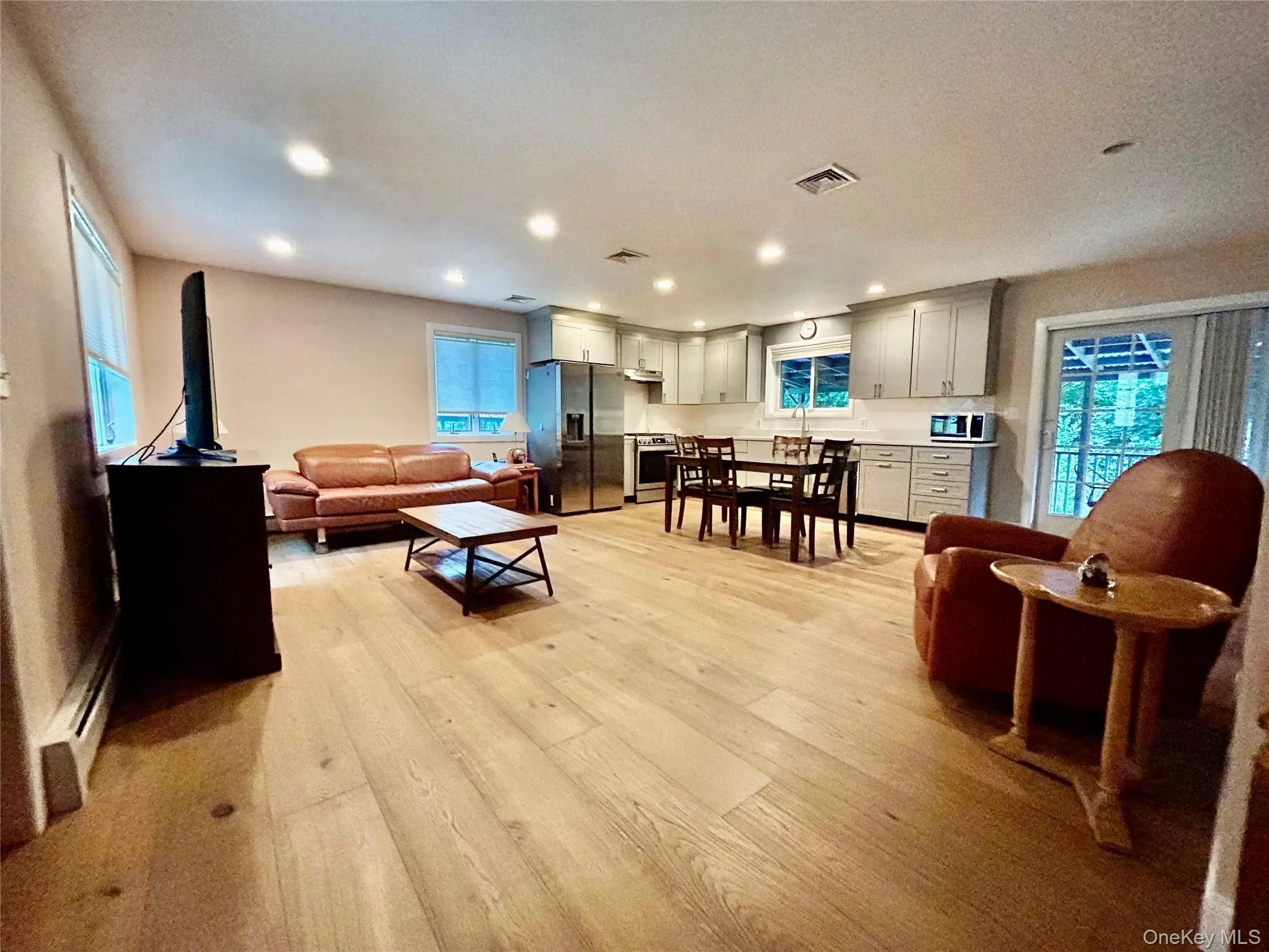 Relax in your living room with so much natural light and many windows. Relax in your living room with so much natural light and many windows.
