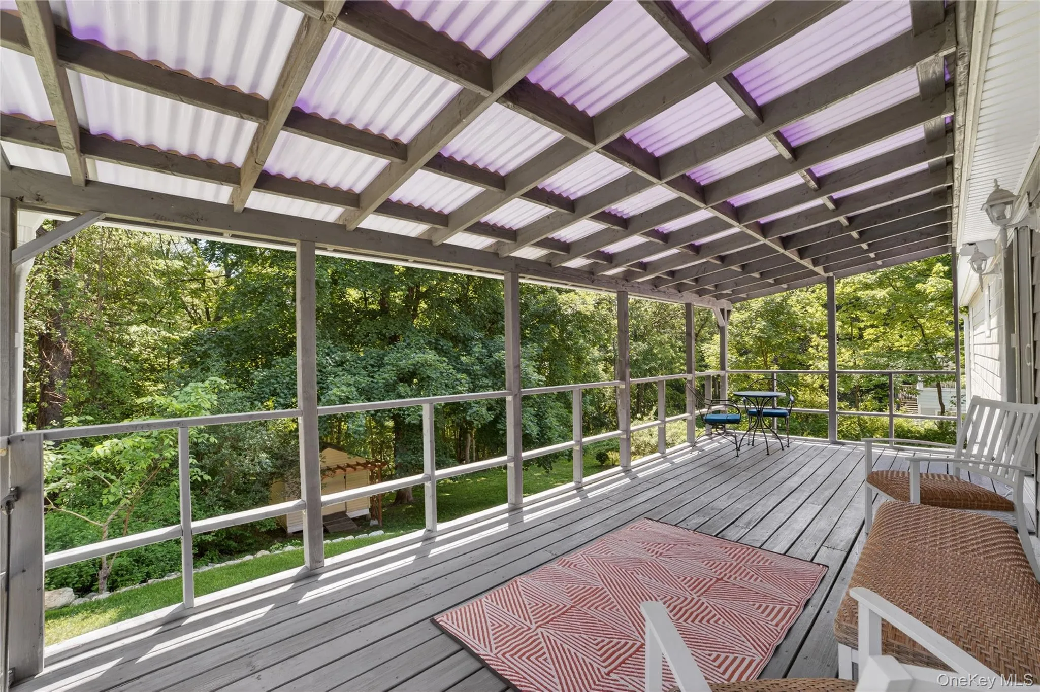 Trex decking and modern railing with covered roofing to enjoy all three seasons. Trex decking and modern railing with covered roofing to enjoy all three seasons.