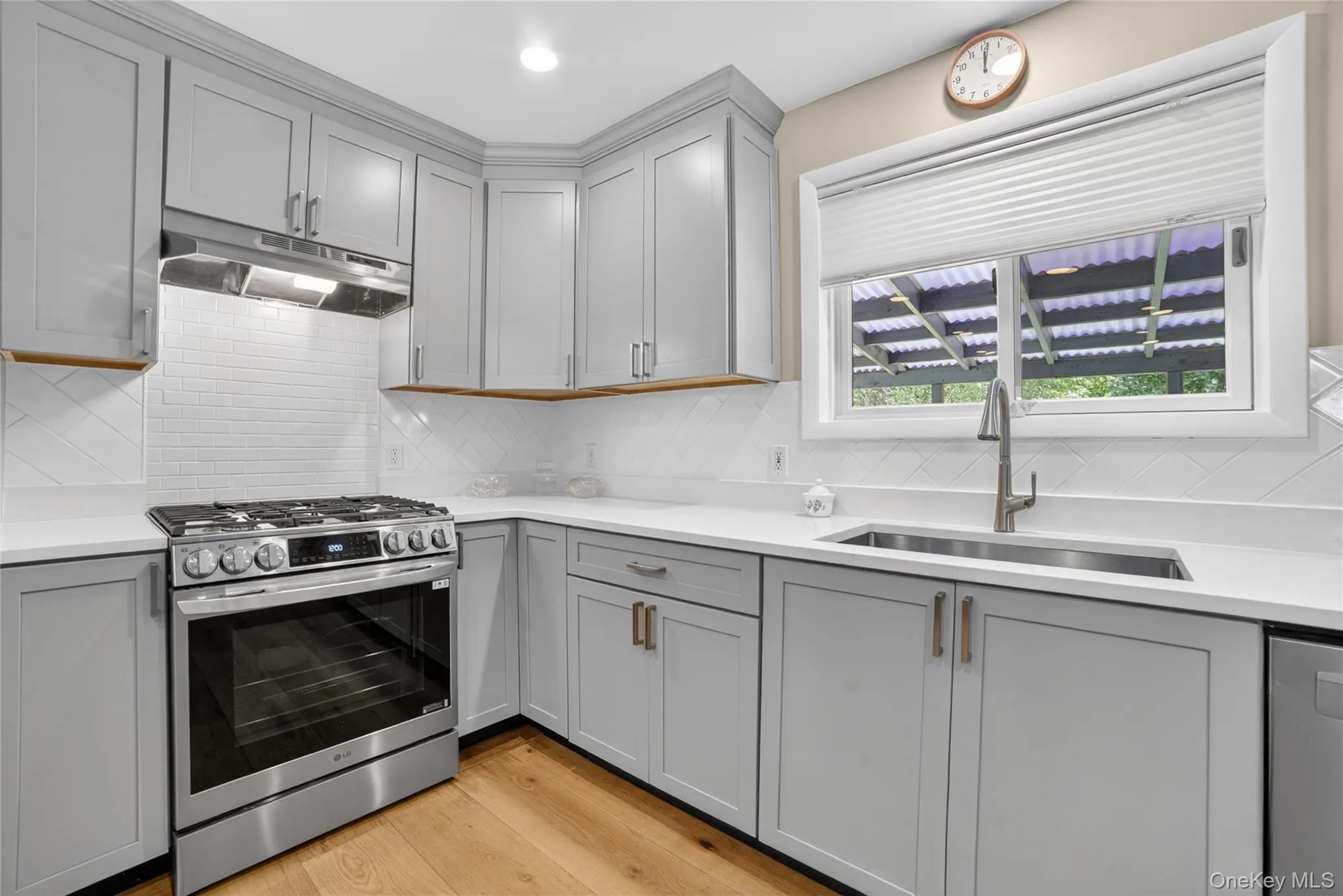 A full double side to side window above the sink for a full view of the deck and backyard. Let the sunshine in! A full double side to side window above the sink for a full view of the deck and backyard. Let the sunshine in!