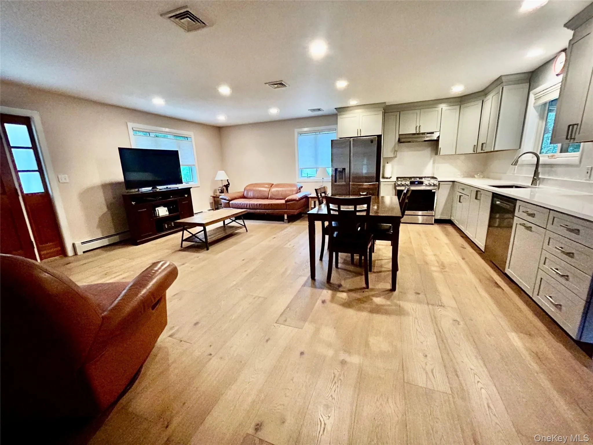 Recessed lighting, hardwood like natural flooring, kitchen with crown molding all the elements of todays designs. Recessed lighting, hardwood like natural flooring, kitchen with crown molding all the elements of todays designs.