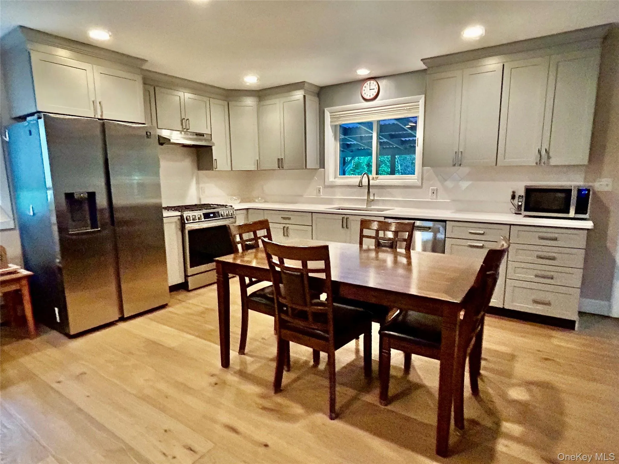 Stunning kitchen details, quartz counters, matching herringbone style tiles with contrasting pattern above the stove, stainless appliances! Stunning kitchen details, quartz counters, matching herringbone style tiles with contrasting pattern above the stove, stainless appliances!